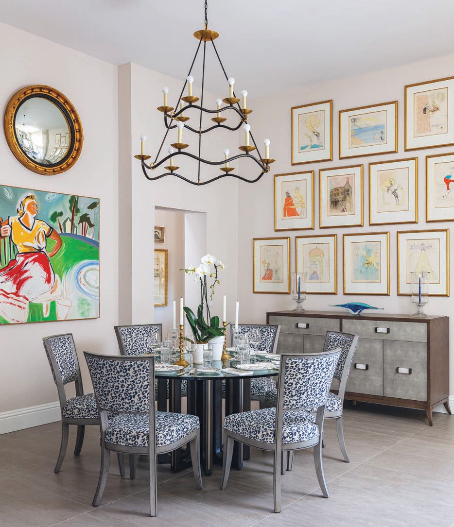 The dining room showcases the homeowners’ collection of Salvador Dalí drawings, which were arranged together to create a focal point BARRY GORALNICK PHOTO BY JASON ZEREN PHOTOGRAPHED BY NICK SARGENT