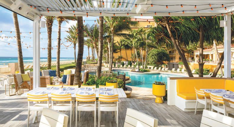 The resort offers alfresco dining by the pool PHOTO COURTESY OF EAU PALM BEACH RESORT & SPA