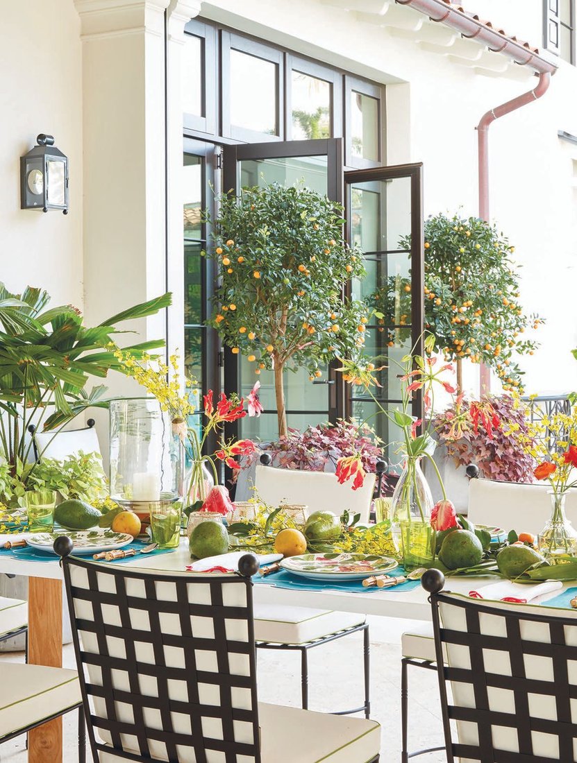 Fruit trees and florals adorn the outdoor patio. PHOTOGRAPHED BY PERNILLE LOOF